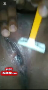 Naughty African babe on camera while shaving her pussy